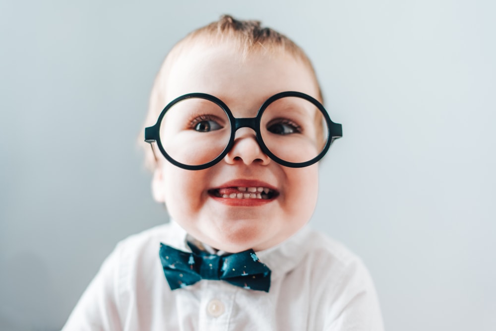 tongue-tied baby wearing glasses